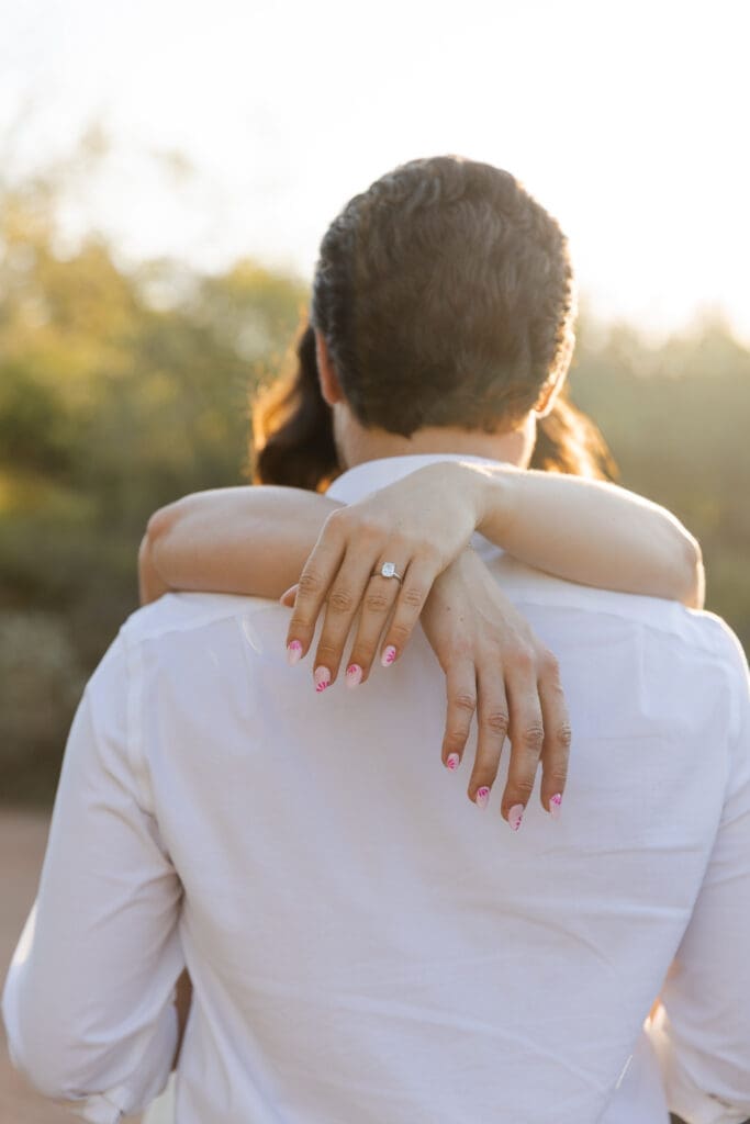 Close up ring portrait, hands behind back. 