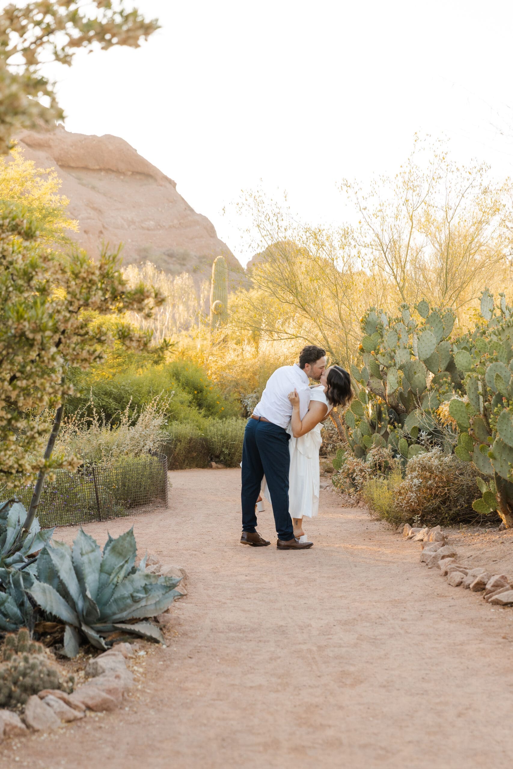 Romantic desert kiss in the desert botanical garden, Phoenix, Arizona. 