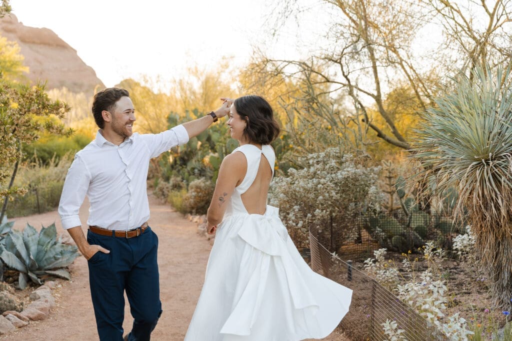 Playful engagement couple's photos with desert background. 