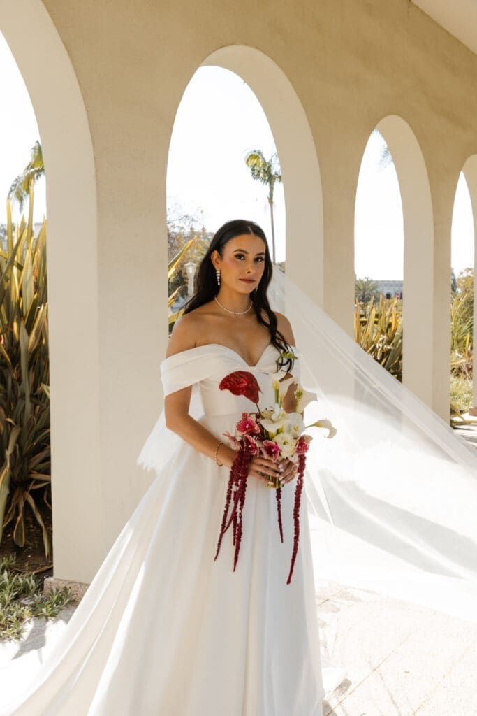 Coastal bridal portrait with archway background.