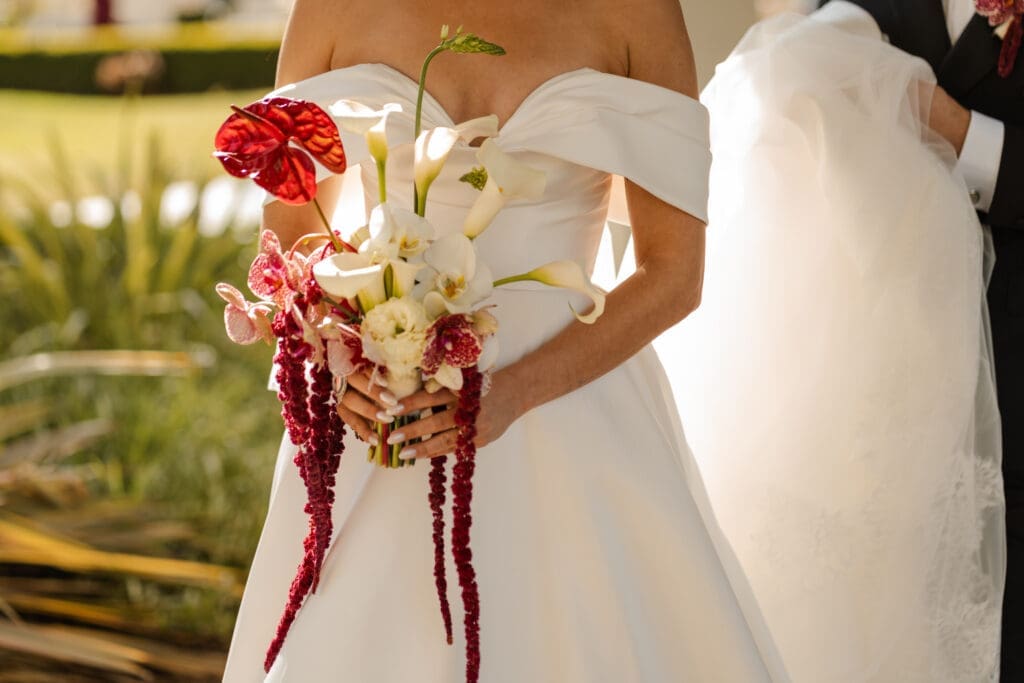 Red and white orchid bouquet for coastal California bride