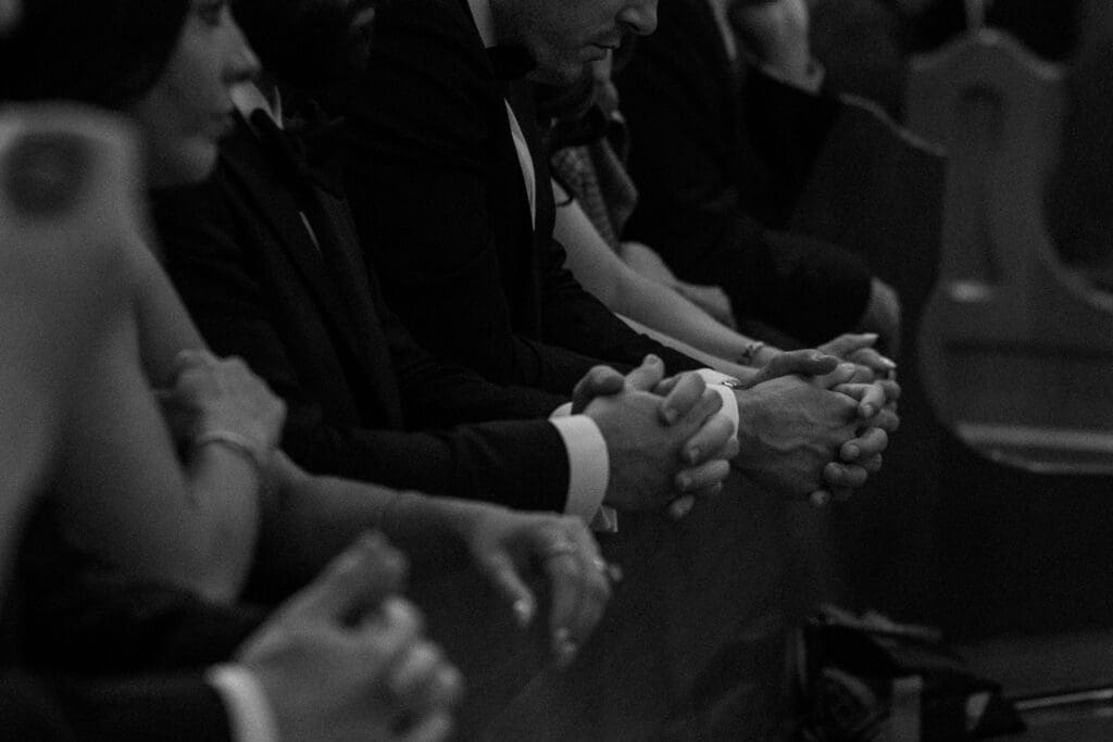 Close up details of guests waiting for wedding ceremony to begin.