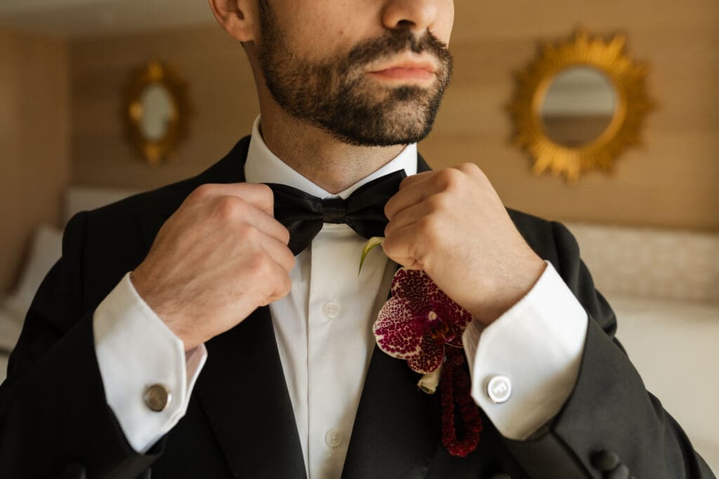Grooms black and white tuxedo detailed portraits